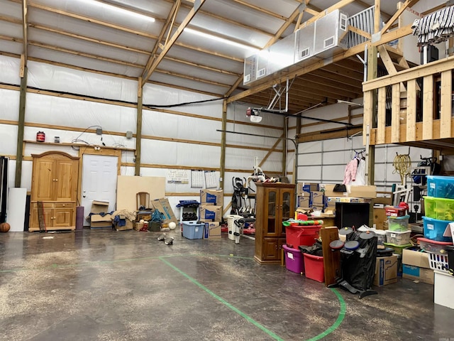 garage with metal wall and a garage door opener