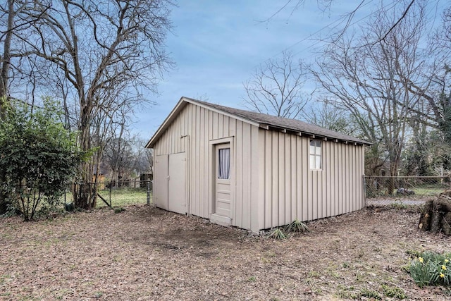 view of shed with a fenced backyard