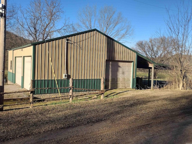 view of outbuilding featuring an outbuilding and driveway