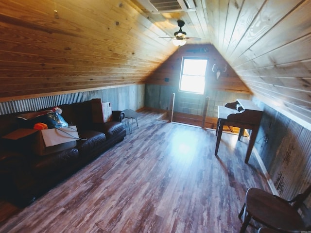 additional living space with lofted ceiling, wood finished floors, wood ceiling, and wooden walls