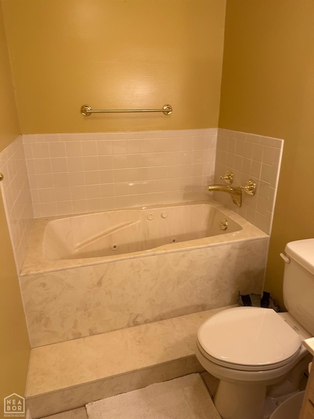 full bathroom with toilet, tile patterned floors, and a whirlpool tub