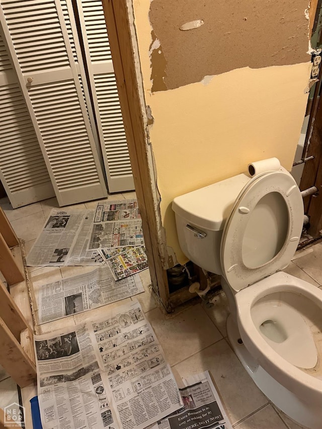 bathroom with tile patterned flooring and toilet