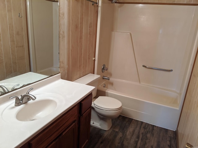 bathroom with shower / washtub combination, vanity, toilet, and wood finished floors