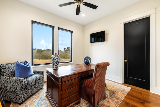 home office featuring a ceiling fan, baseboards, wood finished floors, and recessed lighting