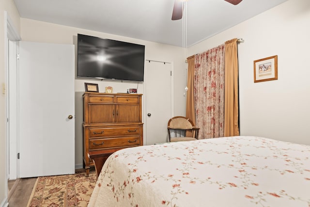 bedroom featuring ceiling fan and wood finished floors