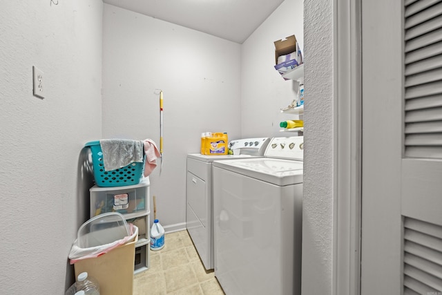 laundry area with laundry area and washer and clothes dryer