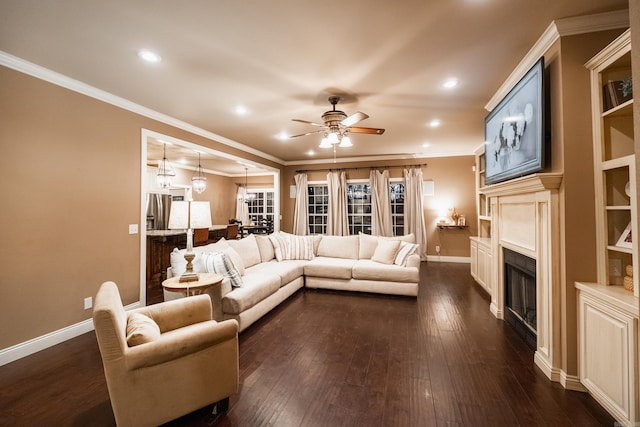 living room featuring crown molding, dark wood finished floors, and a fireplace