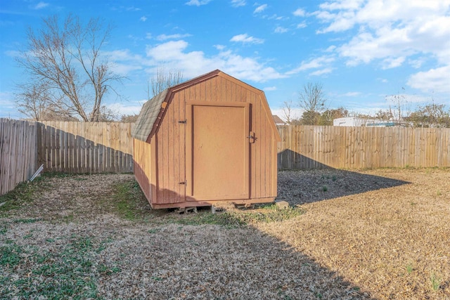 view of shed with a fenced backyard