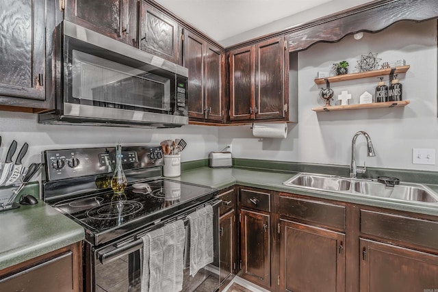 kitchen with black electric range, stainless steel microwave, a sink, and dark brown cabinetry