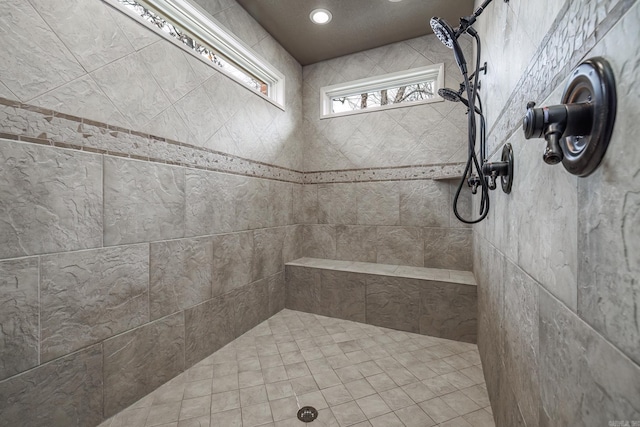 bathroom with a tile shower