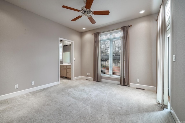 unfurnished bedroom featuring baseboards, recessed lighting, and light colored carpet