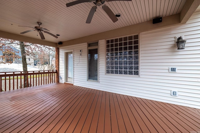 wooden terrace with a ceiling fan