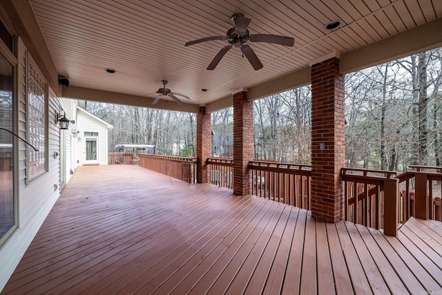 wooden deck featuring a ceiling fan