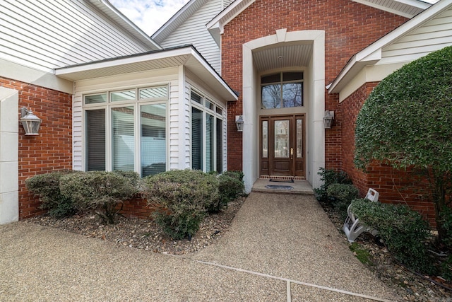 entrance to property with brick siding