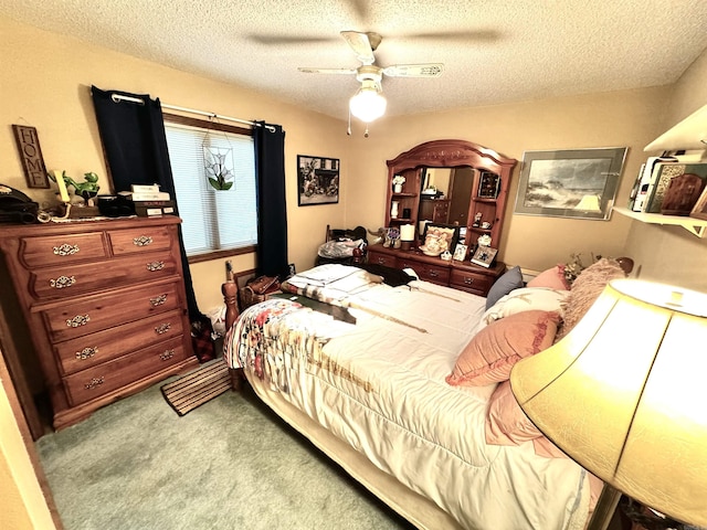 bedroom with carpet, a ceiling fan, and a textured ceiling