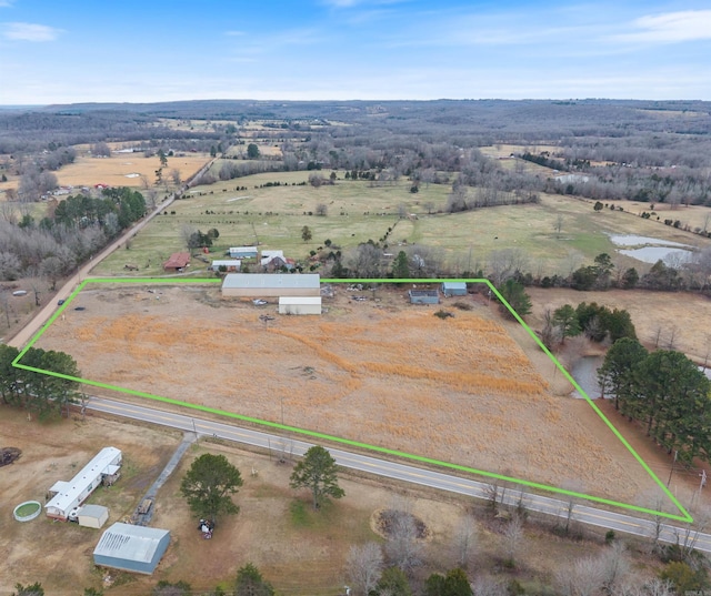 birds eye view of property featuring a rural view