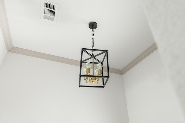 room details featuring visible vents and ornamental molding