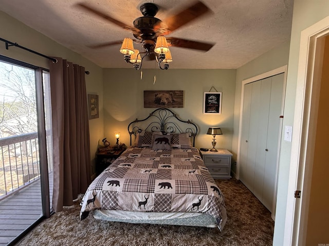 bedroom with access to exterior, ceiling fan, carpet floors, and a textured ceiling