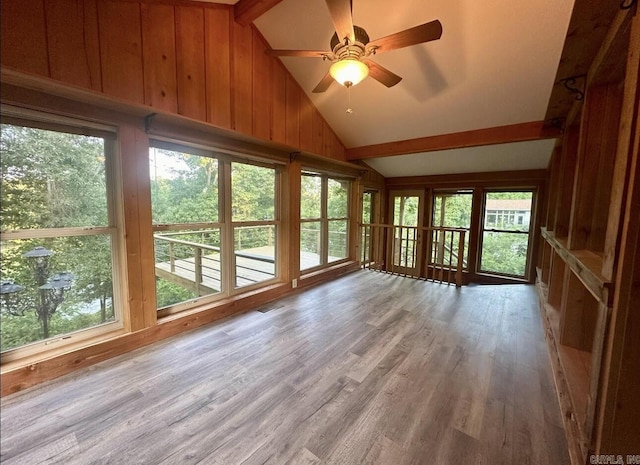 unfurnished sunroom featuring lofted ceiling and ceiling fan