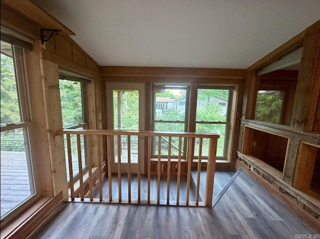 unfurnished sunroom with lofted ceiling