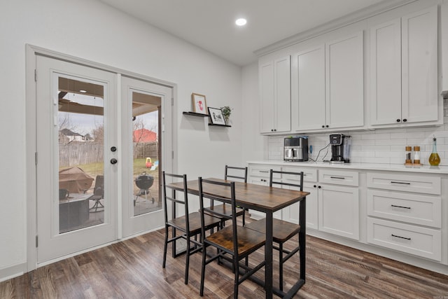 dining area featuring dark wood-style floors, recessed lighting, and french doors