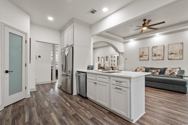 kitchen featuring open floor plan, appliances with stainless steel finishes, dark wood-style floors, and visible vents