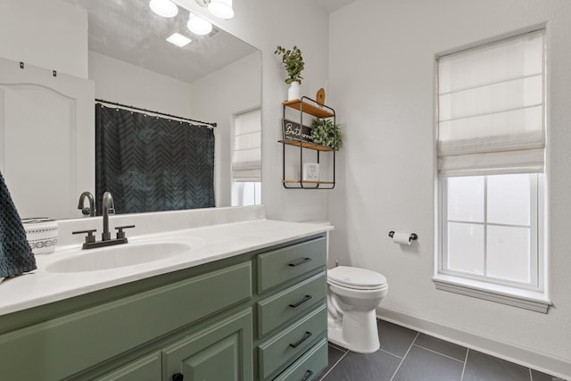 full bath with baseboards, vanity, toilet, and tile patterned floors