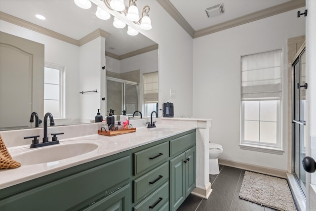 bathroom featuring crown molding, a stall shower, tile patterned flooring, and a sink