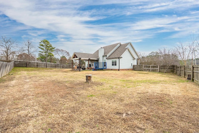 view of yard with a fenced backyard