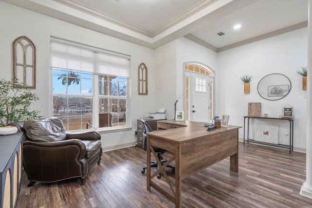 office area with ornamental molding, visible vents, baseboards, and wood finished floors