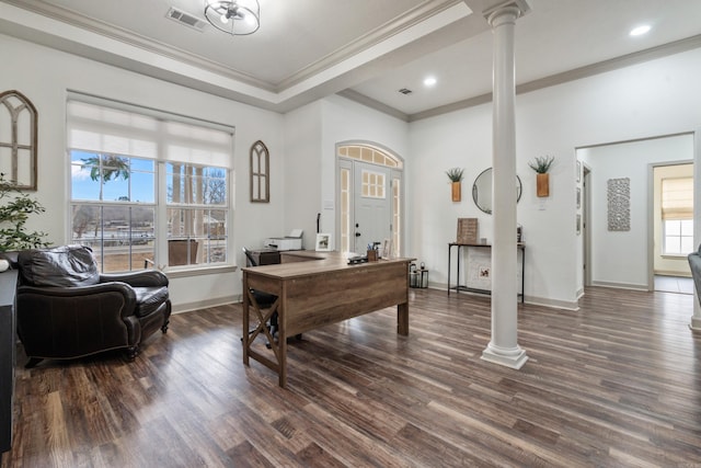 office area featuring dark wood-style floors, decorative columns, visible vents, and baseboards