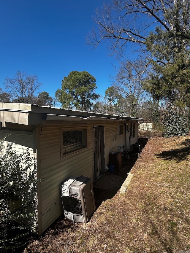 back of property with central AC unit