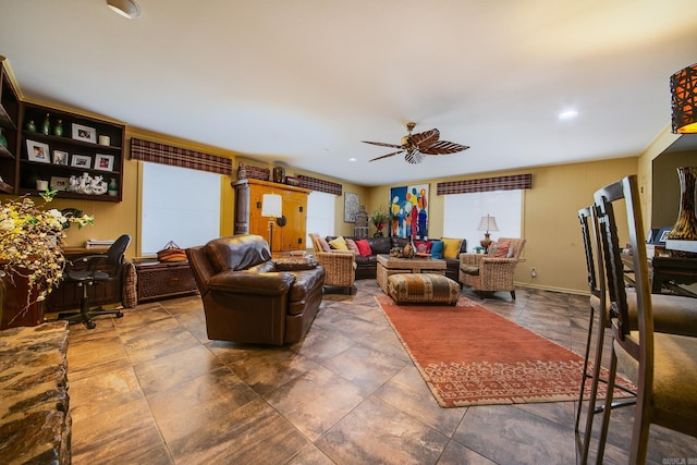 living area with a ceiling fan