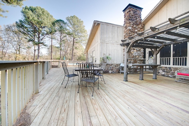 wooden deck with outdoor dining area