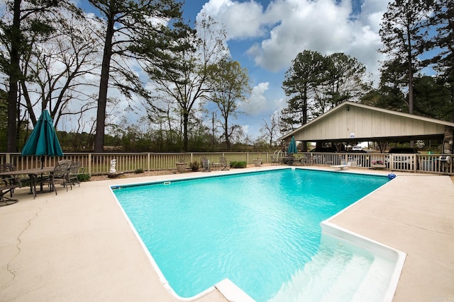 view of pool featuring a patio area, a grill, fence, and a fenced in pool