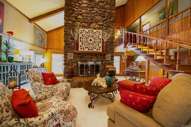 tiled living area featuring high vaulted ceiling, wooden walls, a fireplace, stairs, and beam ceiling