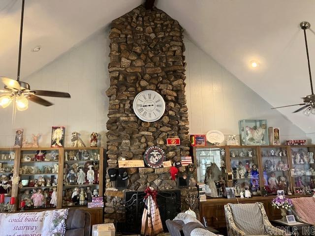 living room featuring a ceiling fan, beam ceiling, and high vaulted ceiling