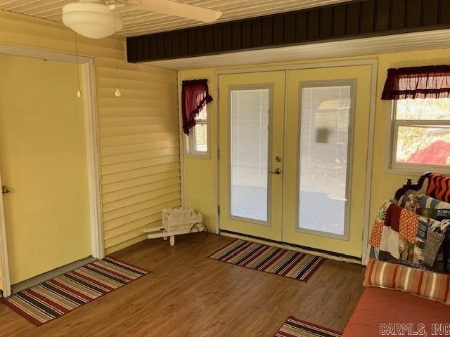 doorway featuring wood finished floors and french doors