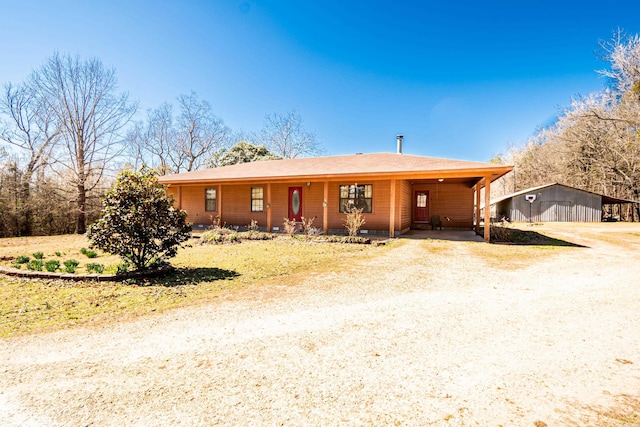 ranch-style home featuring dirt driveway