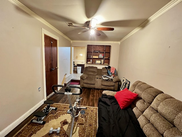 living room with ceiling fan, baseboards, crown molding, and wood finished floors