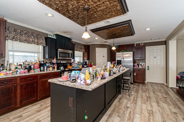 kitchen with an ornate ceiling, light wood finished floors, decorative backsplash, appliances with stainless steel finishes, and ornamental molding