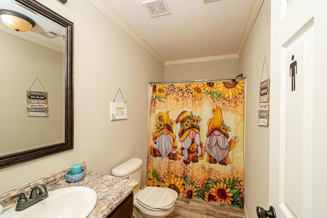 bathroom featuring a textured ceiling, toilet, vanity, visible vents, and ornamental molding