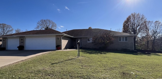 ranch-style home with a garage, concrete driveway, brick siding, and a front lawn