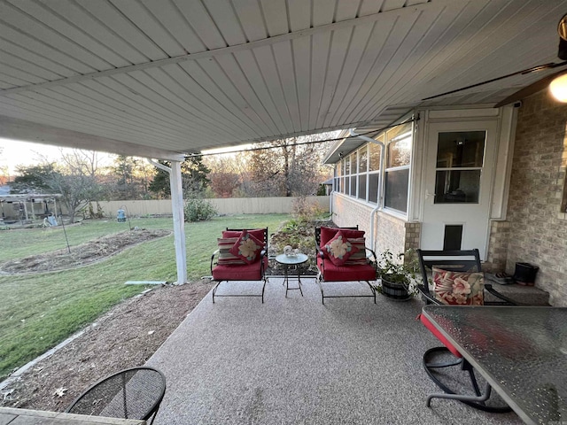 view of patio featuring fence