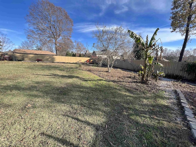 view of yard with a fenced backyard