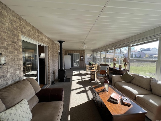 sunroom with a wood stove