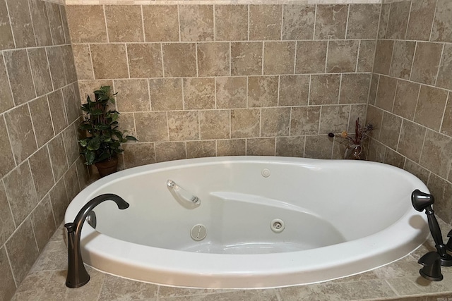 full bathroom with a jetted tub