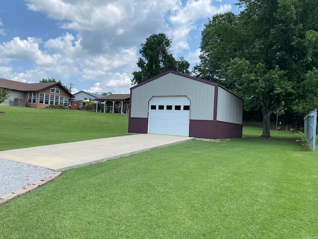 detached garage featuring driveway