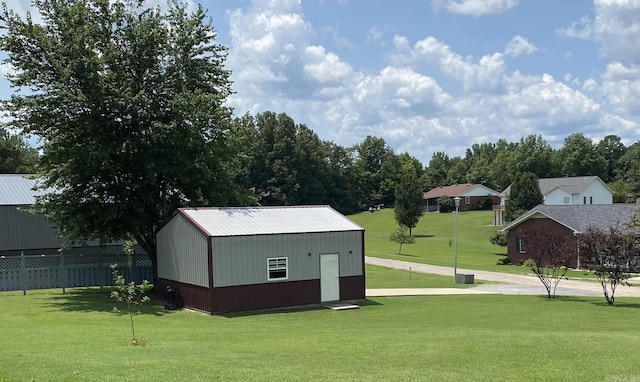 view of outbuilding with an outbuilding and fence