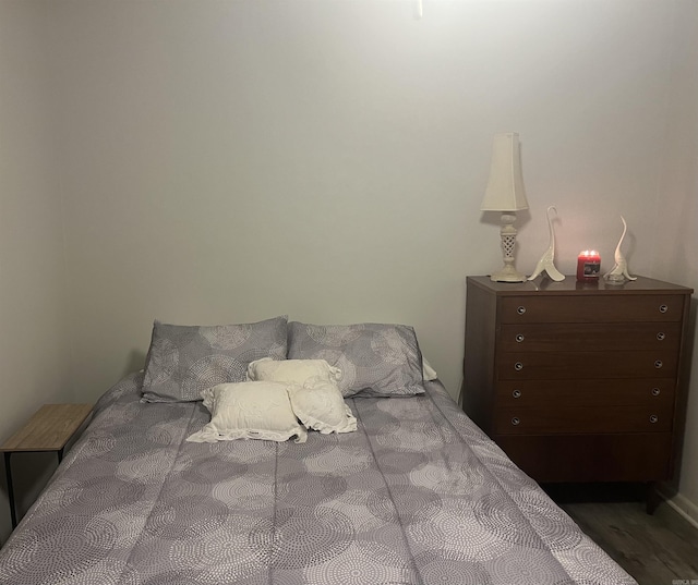 bedroom featuring wood finished floors